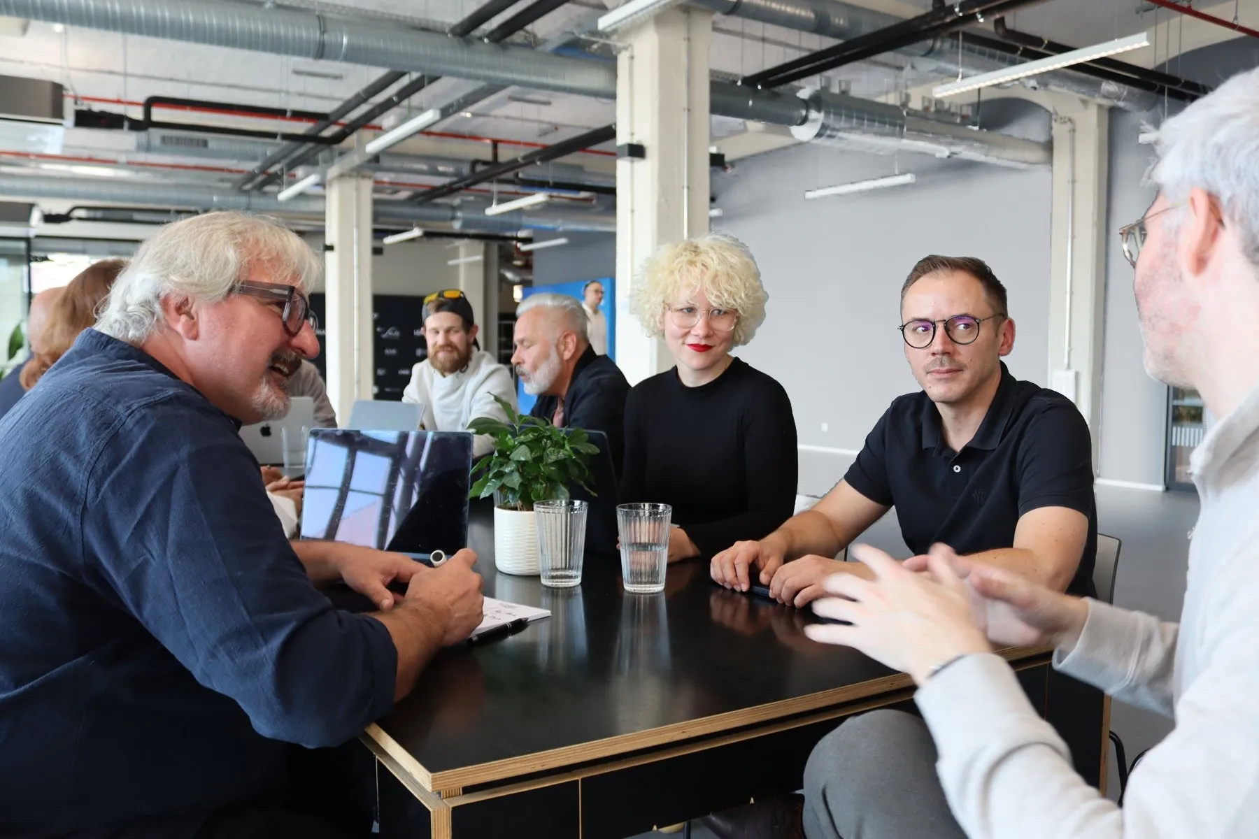 Conversation with the team at a table